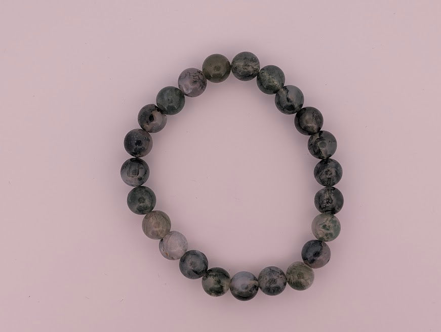 Lay-flat 8 mm Moss Agate stretch bracelet with evenly graded beads.