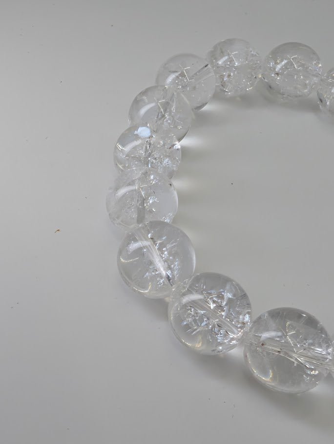 12mm Himalayan clear quartz bracelet with high polish and internal rainbows