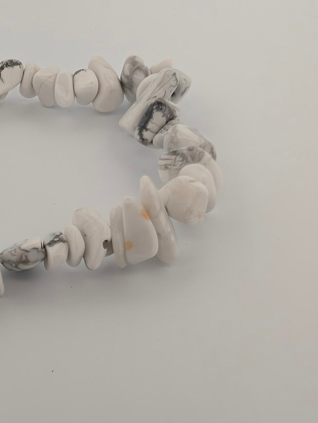 Close-up of Howlite chip beads with organic shapes and grey veining