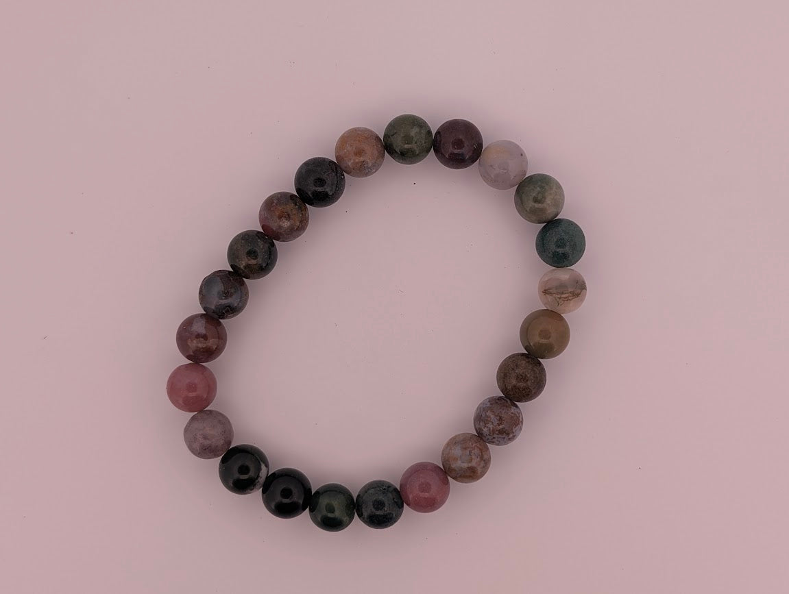 Overhead view of 8mm Indian Agate round bead stretch bracelet showing mixed colors