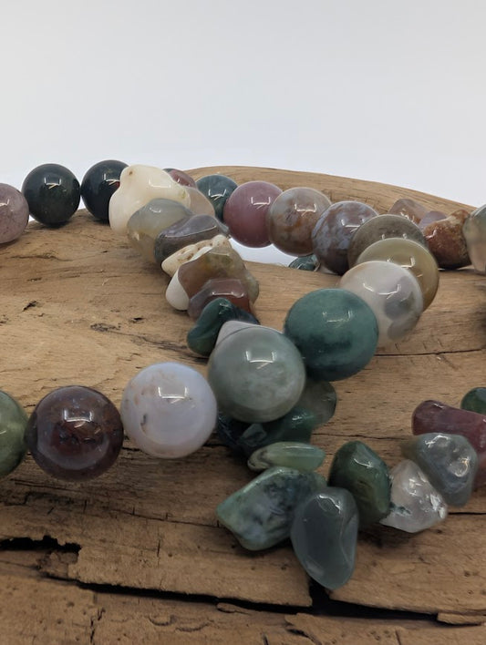 Close-up of Indian Agate chip and round beads showing polished finish and multi-color patterns