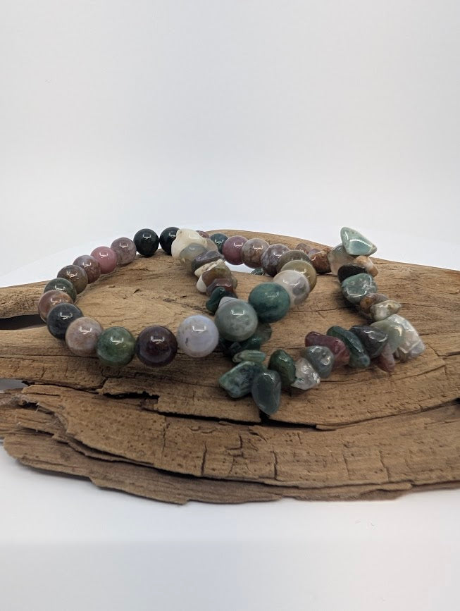 Indian Agate chip and 8mm round bead stretch bracelets on driftwood in earthy green, red and neutral tones
