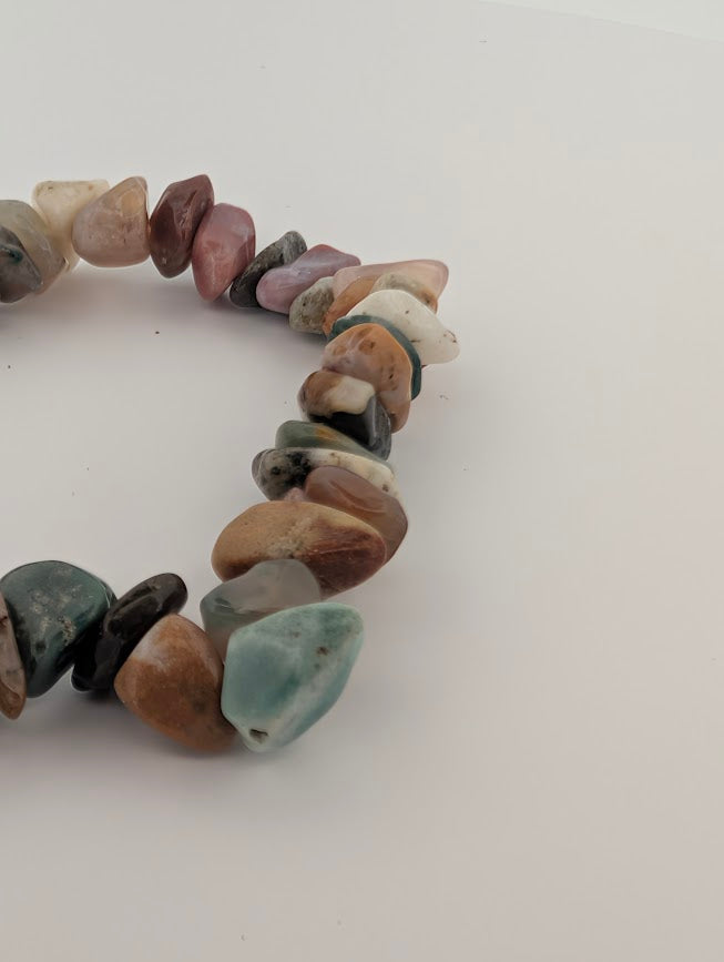 Macro of Indian Agate chip beads highlighting natural variation and earthy palette