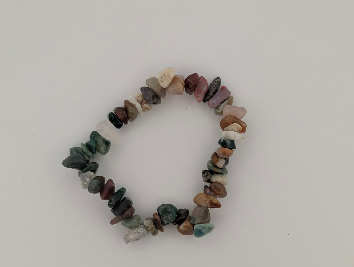 Overhead view of Indian Agate chip bead bracelet on white background