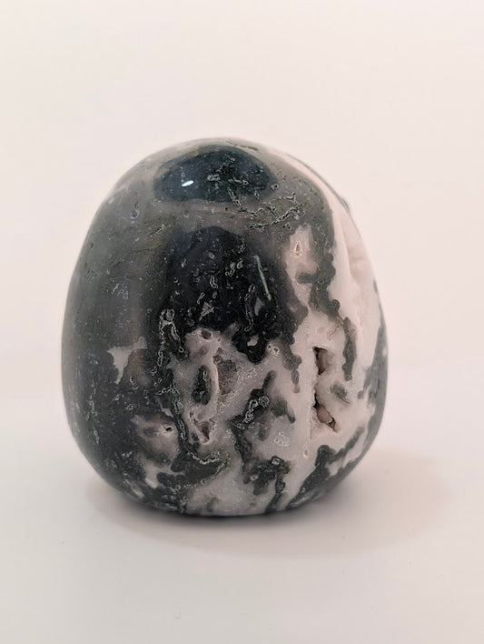 Back view of Moss Agate Jack Skellington carving showing green dendritic “moss” inclusions and glossy polish