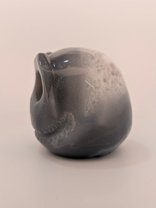 Detail of Ocean Agate Jack Skellington carving showing soft grey banding and glossy polish