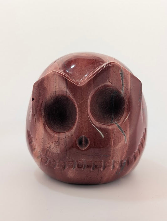 Detail of Red Jasper Jack Skellington carving showing rich red tones and natural veining
