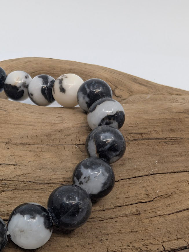 Macro of Zebra Jasper beads showing bold monochrome marbling