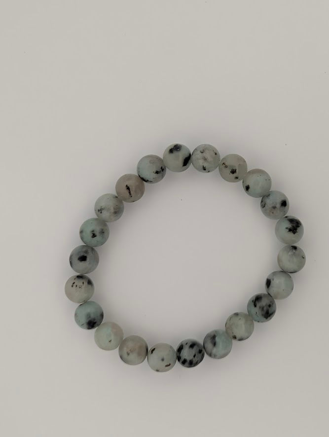 Top-down view of 8mm Kiwi Jasper stretch bracelet in soft green tones.