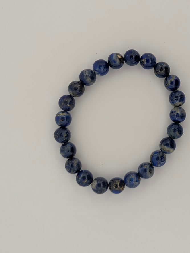 Top-down view of 8mm Lapis Lazuli bracelet in deep royal blue.