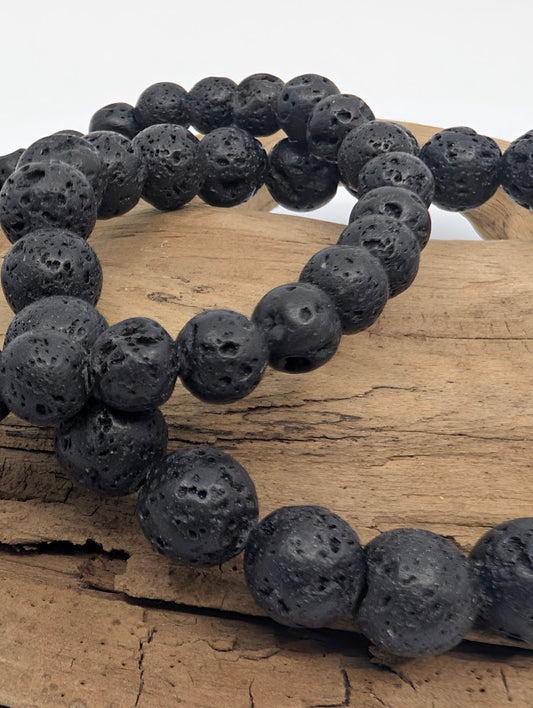 Close-up of porous 8mm lava stone beads showing natural texture
