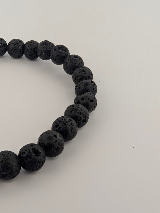 Close-up of 6mm lava stone beads with natural diffuser pores