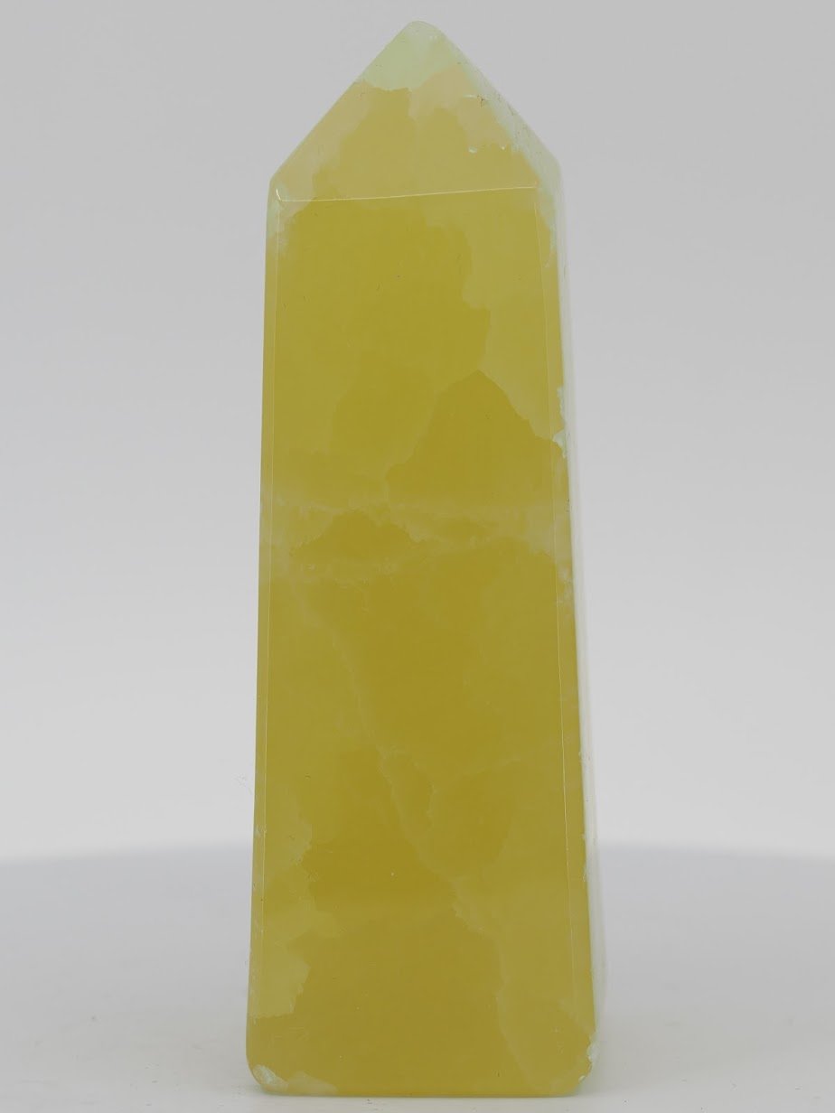 Polished Lemon Calcite tower from Pakistan featuring intense golden-yellow translucency and a high-gloss luster.