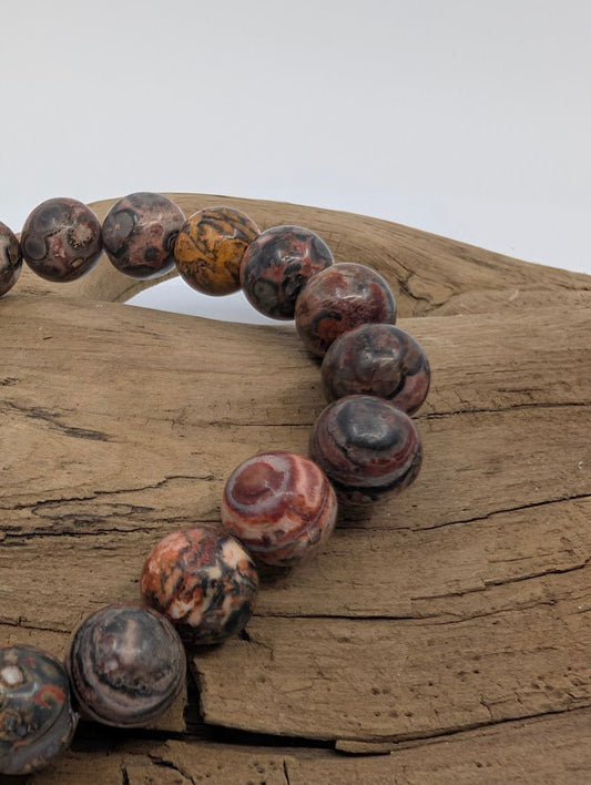 Close-up of leopard jasper beads showing bold rosettes and earthy tones