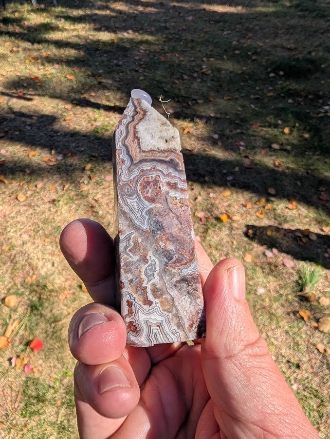 Mexican Lace Agate Tower angled view – polished specimen showing natural quartz cavity