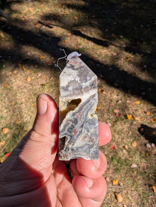 Mexican Lace Agate Tower #2 side view — banded chalcedony with open quartz cavities