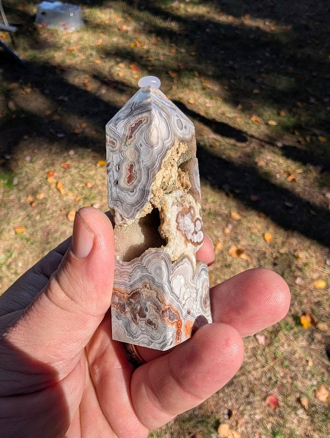 Mexican Lace Agate Tower #7 angled view — compact tower with eye patterns and druzy sparkle