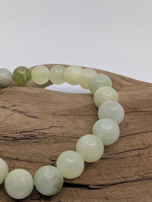 Close-up of Milk Jade beads showing creamy translucence
