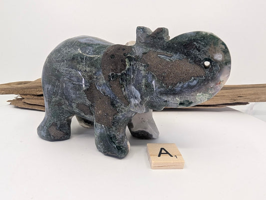 Profile of Moss Agate elephant A showcasing dark green forest-like inclusions on white chalcedony.