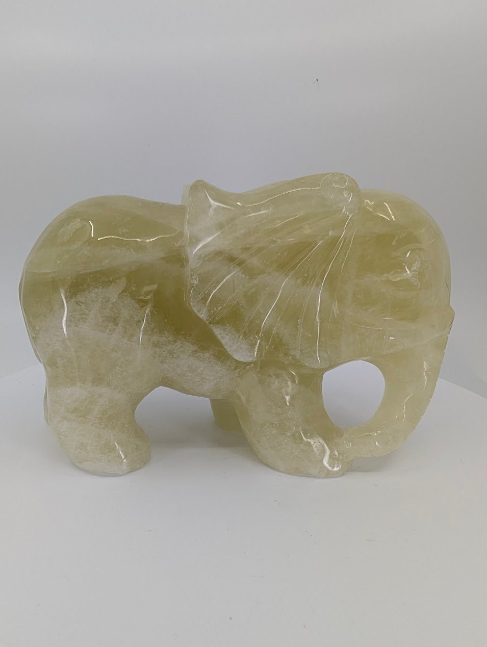 Rear angled view of natural Lemon Citrine elephant carving