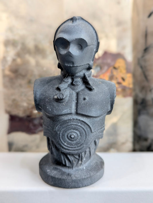 Front view of matte obsidian C-3PO droid bust carving.