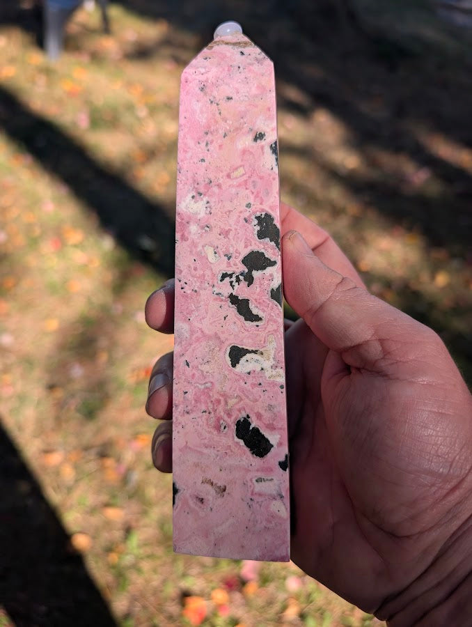 Back view of rhodonite tower #2 showing flowing cream and black patterns