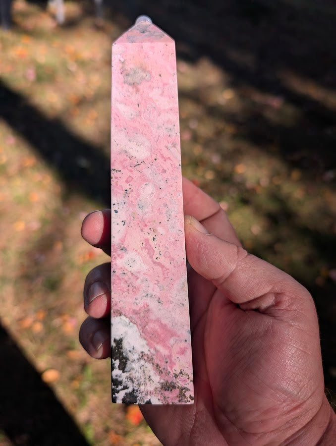 Back view of rhodonite tower #3 highlighting cloud-like pink textures and polished finish