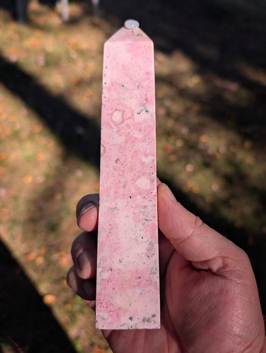 Peruvian rhodonite tower #3 front view showing pastel pink marbling and fine black veining