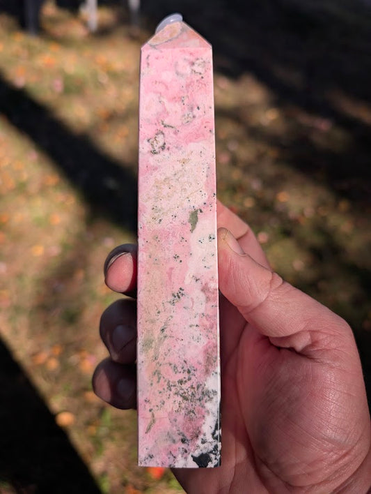 Left face of rhodonite tower #3 with soft swirling pink patterns and subtle manganese accents