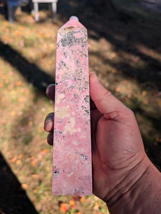 Front view of Peruvian rhodonite tower #5 showing pink body with black veining