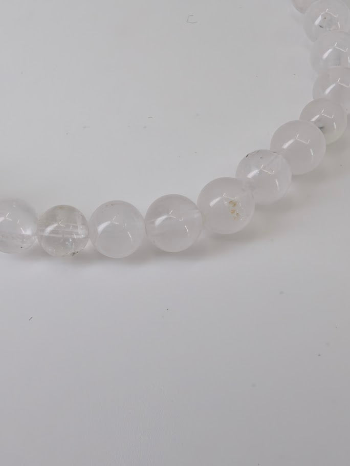 Petroleum Quartz Bracelet detail showing visible oil and carbon inclusions in clear quartz beads