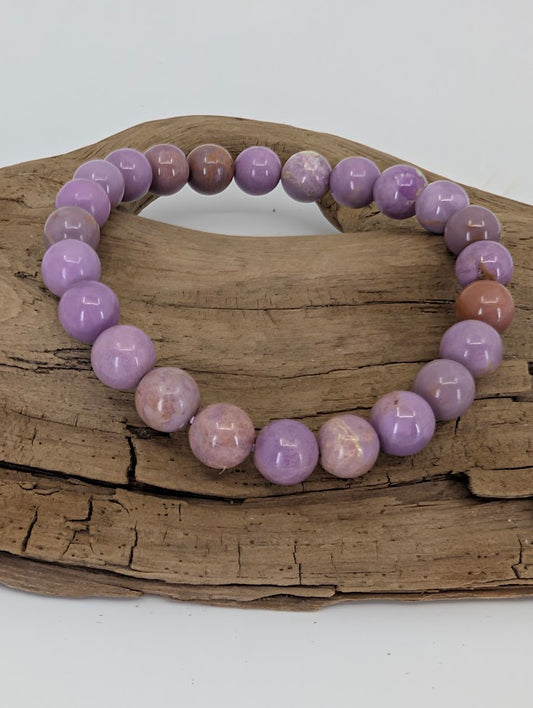 Front view of 8mm Phosphosiderite bracelet displaying pastel lavender beads