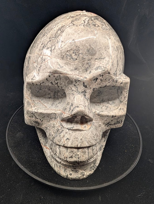 Picasso Jasper Skull front view — 5.2 kg polished carving with graphic veining