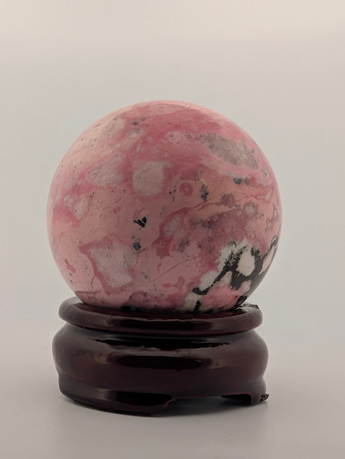 Rear view featuring soft transitions of pink, white, and gray