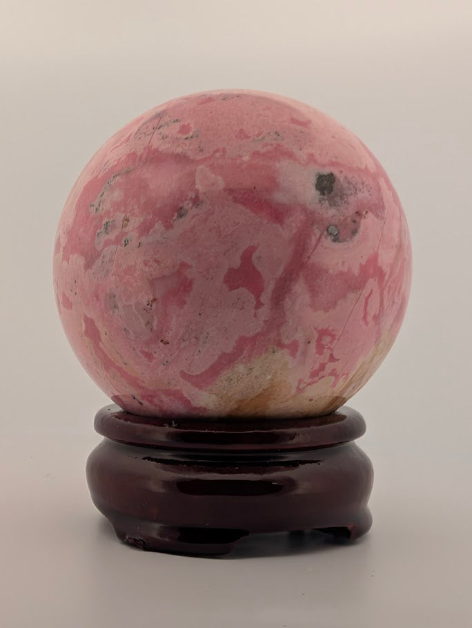 Rear view with warm beige base and soft pink swirls