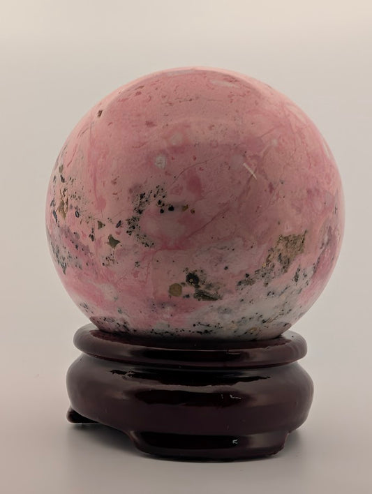 Front view showing pink and white veining with black inclusions