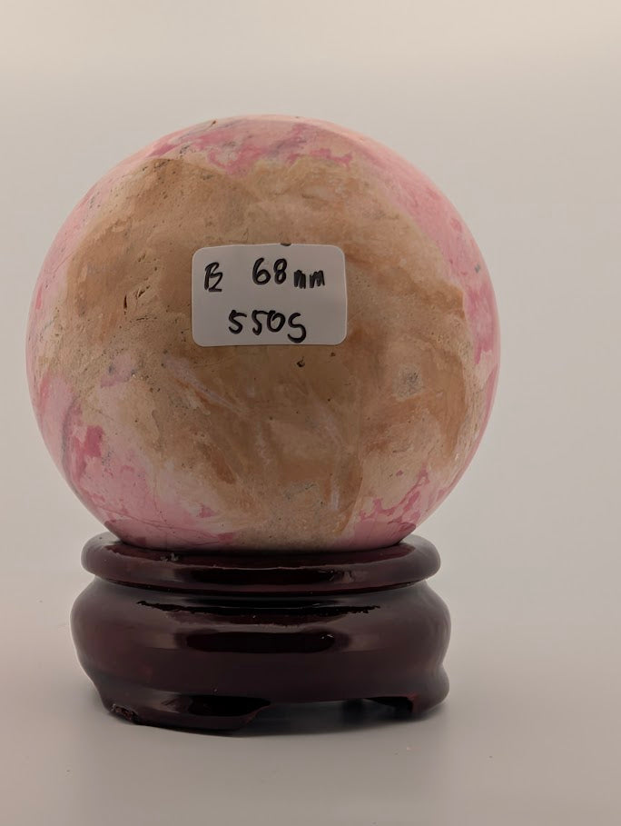 68 mm 550 g Pink Peruvian Rhodonite sphere with identification label