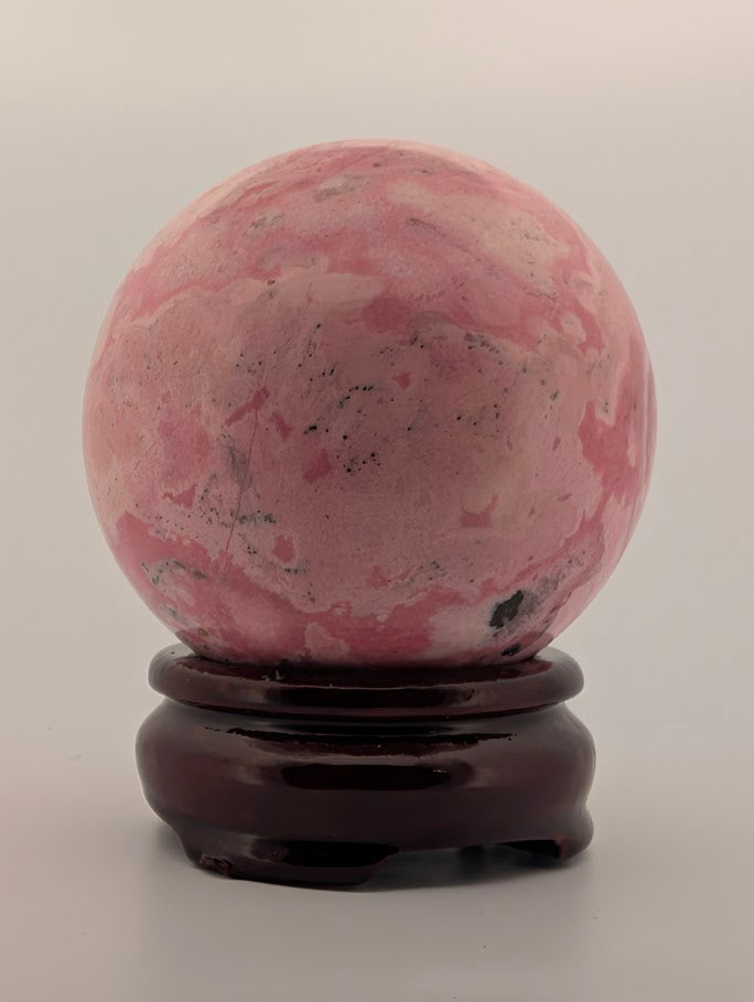 Polished surface under soft light emphasizing marbled tones