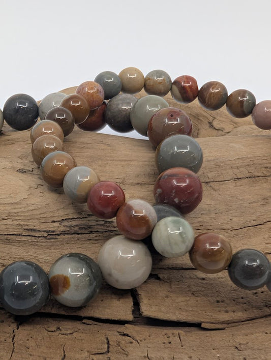 Close-up of Polychrome Jasper beads showing ochre, red and grey tones