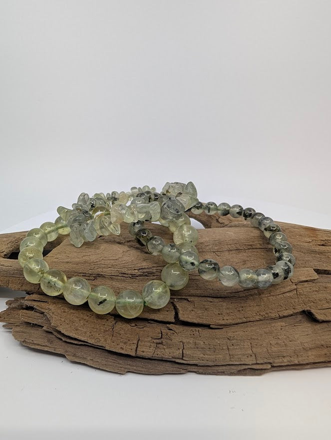 Mixed Prehnite bracelets—6mm, 8mm and chip—apple-green with dark inclusions on driftwood.