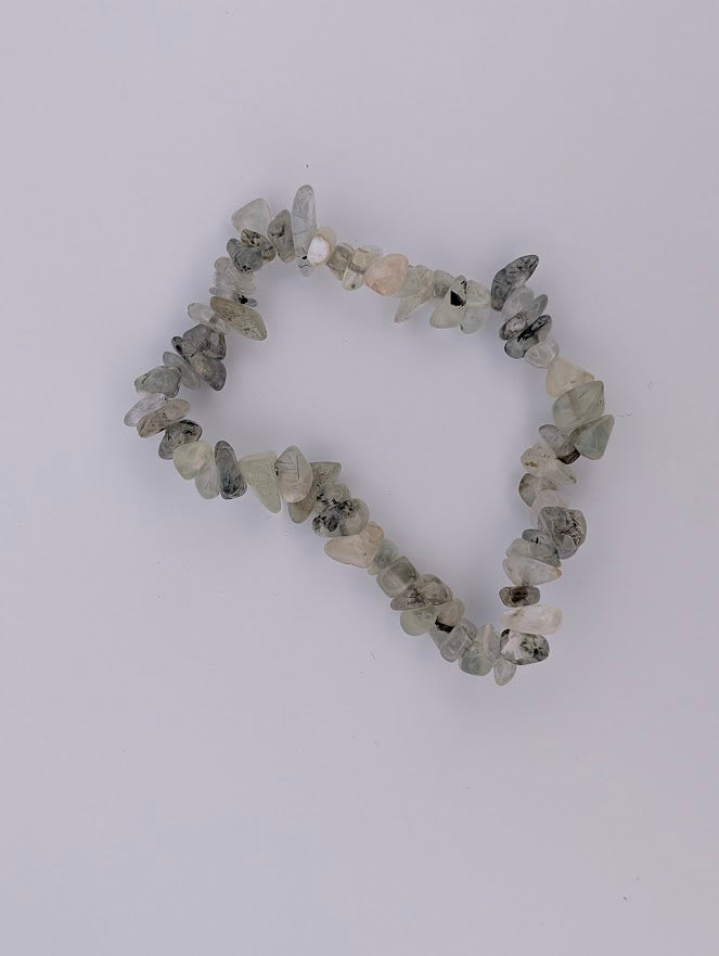 Prehnite chip bracelet, top-down, tumbled pale-green chips with natural variation.
