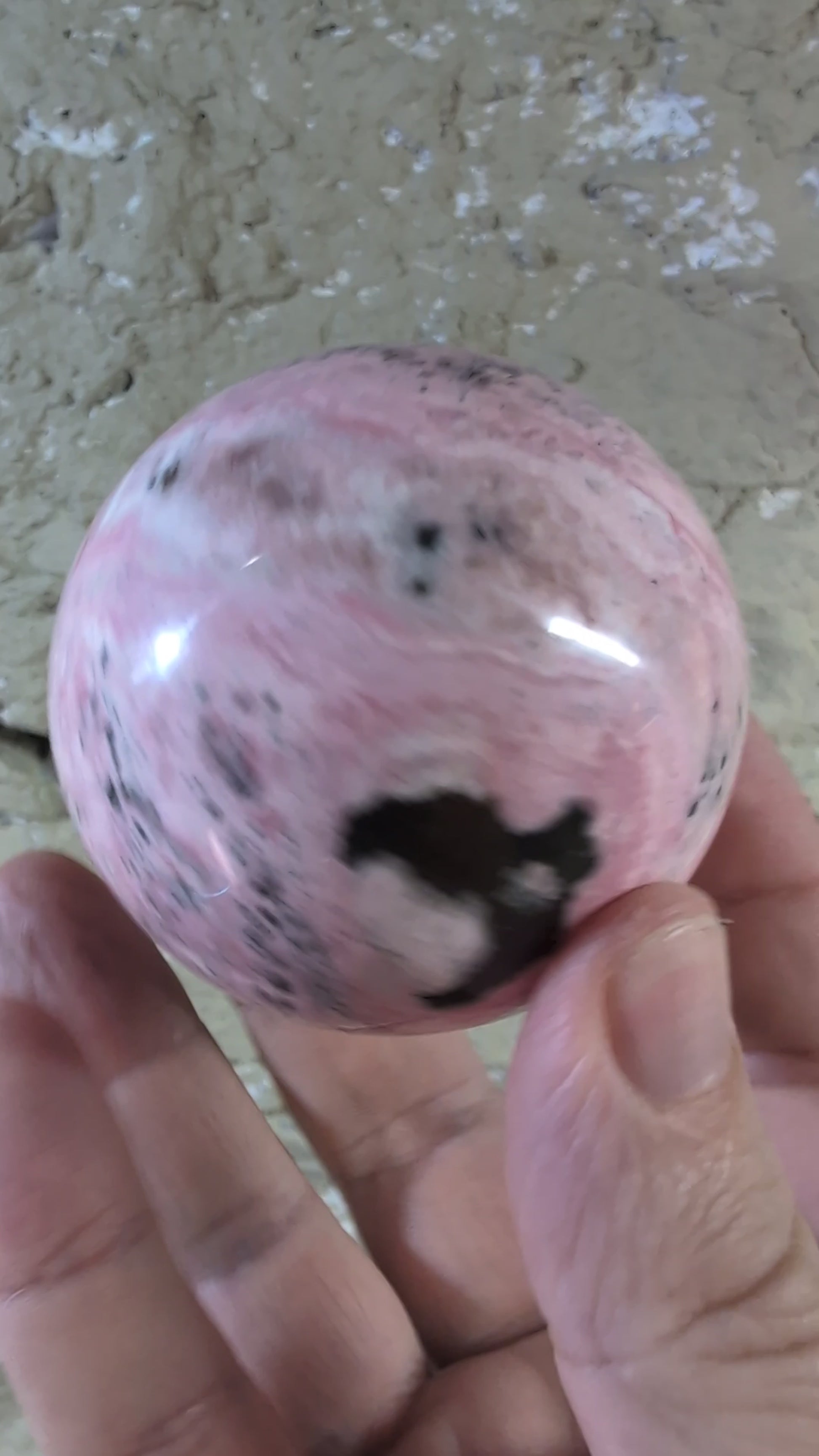 Video of 60mm 395g of polished pink rhodonite sphere with bold contrast