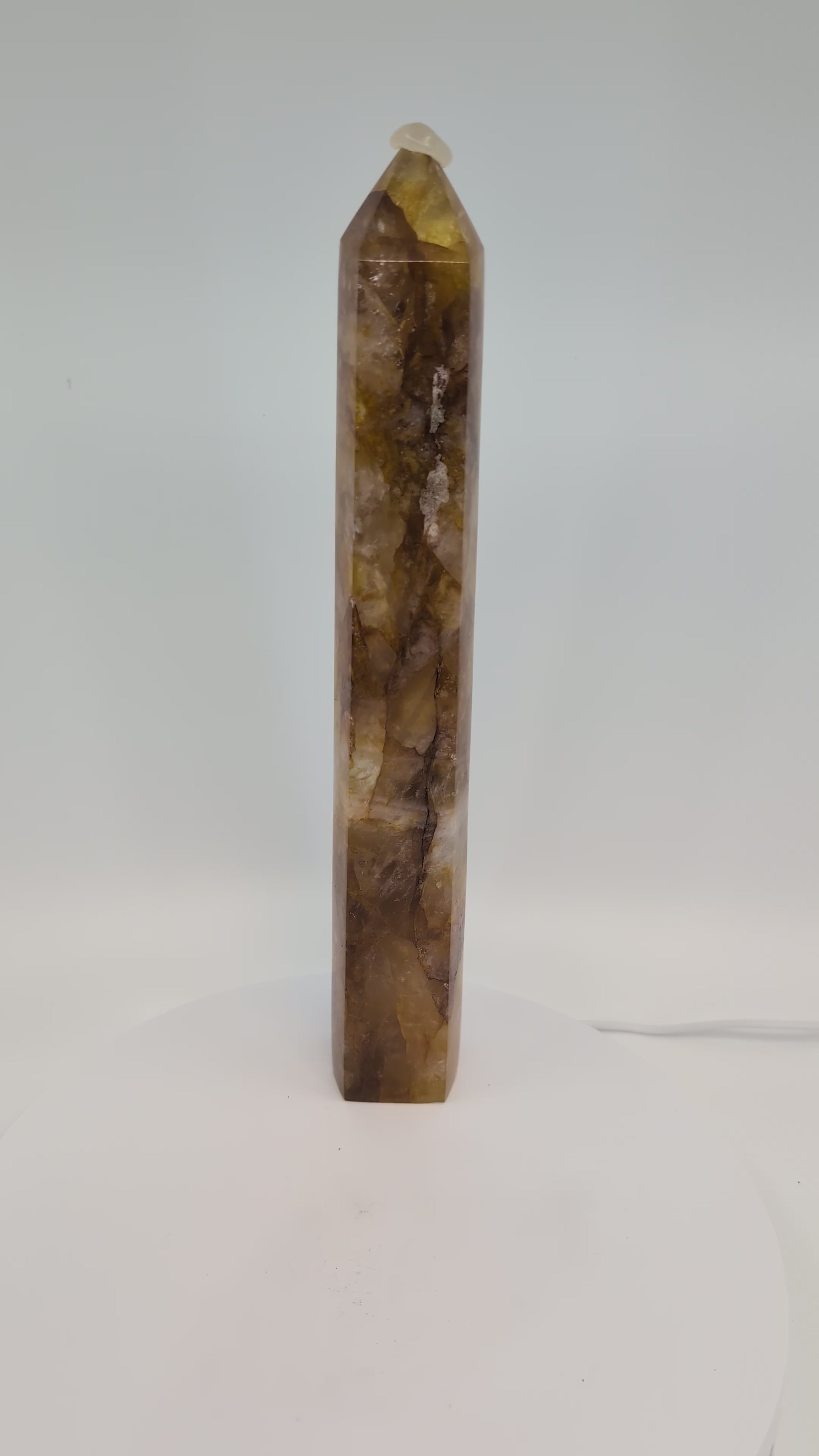 Large Golden Healer Quartz Tower 1.04 kg from Brazil rotating in natural light, showing translucent zones and polished termination