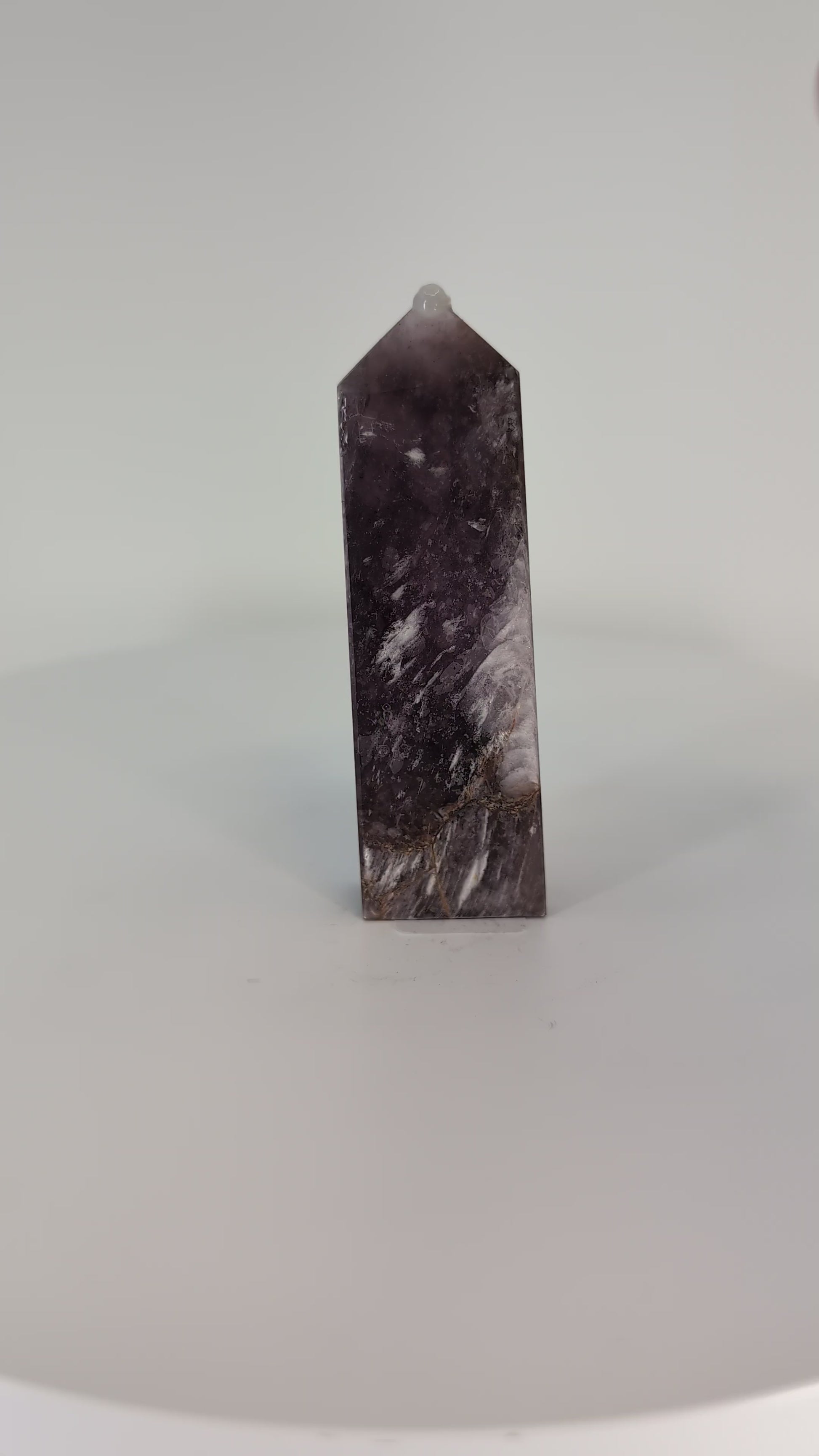Rotating video of Purple Mica Tower from Madagascar – hand-polished crystal shimmering with purple and silver reflections.