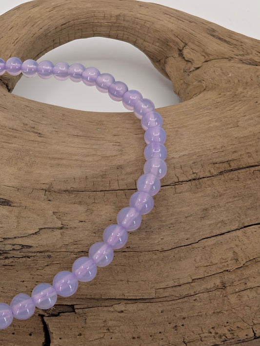 Close-up of lavender jade beads with gentle shine