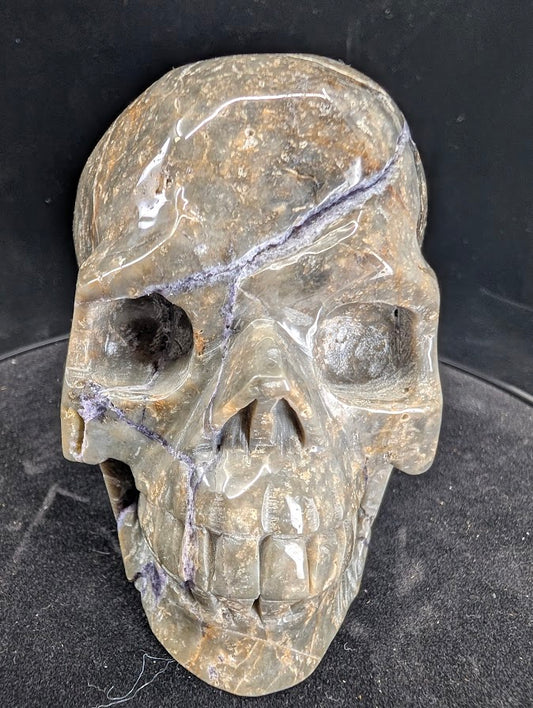 Front view of 1.02 kg Purple Silk Fluorite Skull showing banded silky fluorite details