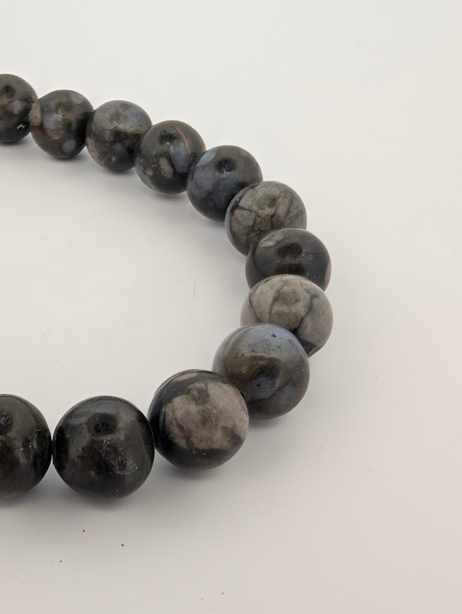 Angled close-up highlighting natural mottled patterns in Que Sera stone