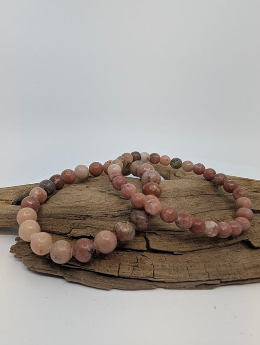 Closeup showing warm red aventurine beads with natural septarian patterns