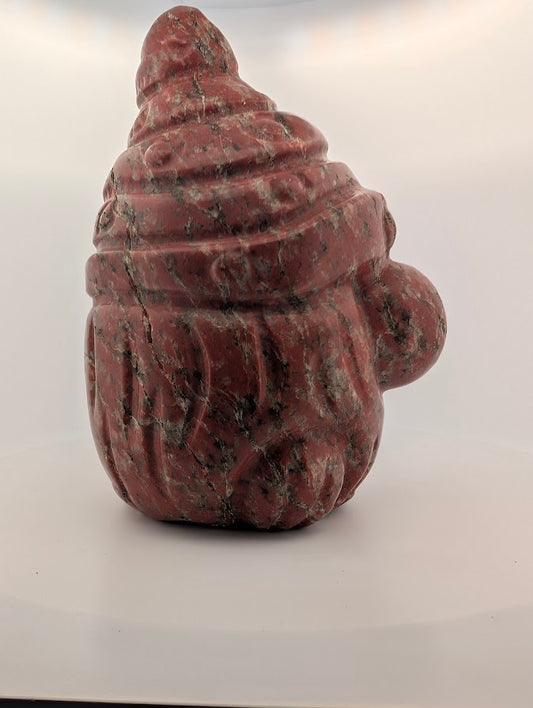 Side angle showing hematite veining and spiral cap details