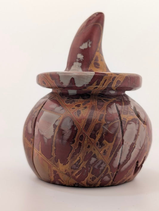 Red jasper pumpkin witch hat carving – side view